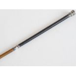 A 19th century silver-plate-mounted riding crop with plaited leather handle (59cm)