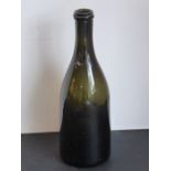 A large 19th century green glass wine bottle (possibly champagne ?), having deep kick-in base (28.