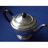 A hallmarked silver teapot; early 20th century, maker's mark TS, Birmingham assay marks (total