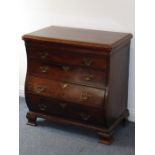 An early 19th century continental mahogany and cross-banded chest; the moulded top above a full-