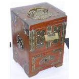 A late 19th century Chinese brass-bound hardwood table cabinet, the swing handle as a Shou character