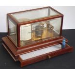 An early 20th century mahogany-cased barograph; with interior gilded-metal ware and the circular