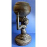 A large African carved wood Luba tribal art female fertility bowl carrier (53cm high)