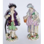 A pair of late 19th/early 20th century hand-decorated Capodimonte porcelain figures; male and