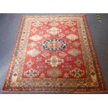A modern Afghan Ziegler carpet, central blue bordered medallion surrounded by further light-blue and