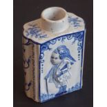 A late 18th century tin-glazed earthenware tea caddy of primarily oval form; the two larger sides