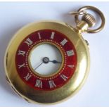 A lady's late 19th/early 20th century 18-carat gold-cased (marked 18K) half hunter pocket watch; the