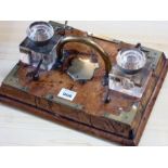 A mid-19th century pollard oak/elm desk stand, brass mounted and with central arched handle over a