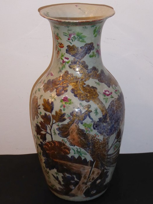 A 19th century Chinese celadon glazed porcelain vase of baluster form; the front gilded and