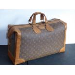 A genuine hand-stitched tan-leather trimmed Louis Vuitton carry bag (Paris, France); applied hand-