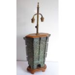 An archaistic-style heavily patinated Chinese bronze wood-mounted table lamp; the height-