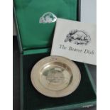 The 'Beaver' dish; a boxed hallmarked silver dish centrally decorated with a beaver on rockwork,