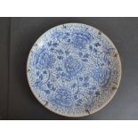 A late 17th/early 18th century circular Chinese porcelain dish; decorated in underglaze blue with