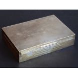 A large and heavy (weighted) rectangular hallmarked presentation silver cigarette case with engine-