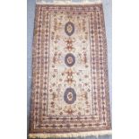 An Afghan Baloch rug of predominately beige ground (203cm x 113cm)