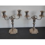 A pair of late 19th/early 20th century two-light silver-plated candelabra by Elkington & Co (fully