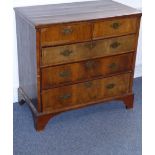 An early 18th century walnut and pine-sided chest; the cleated top above two half-width and three