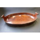 An 18th century style oval mahogany two-handled serving tray coopered with two brass bands, small