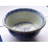 A late 18th/early 19th century Japanese porcelain bowl of deep form; the well centrally decorated