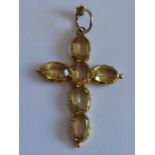 A yellow-metal crucifix mounted with six oval hand-cut gemstones (probably citrines), the suspension