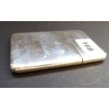 A hallmarked card case of rectangular form with rounded corners, initial engraved 'J', marks rubbed,