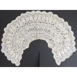 A circa 1890s Brussels lace shawl collar; semi-circular shape with floral motifs and scalloped edge