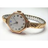 A ladies octagonal shaped 9-carat gold wristwatch with white-enamel dial, in working order