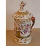 A unusual and large 19th century Capodimonte porcelain tankard and cover; the cover finial as a