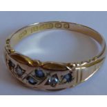 A late 19th/early 20th century 15-carat rose-gold dress ring set with small diamond and sapphire