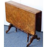 A 19th century figured walnut-topped drop-leaf gate-leg table; two turned swing-out legs on