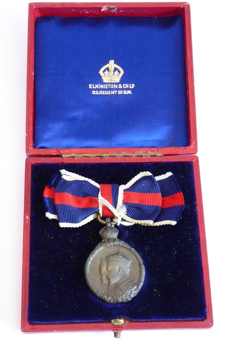 An Edward VII Coronation medal 1902; the obverse with combined busts of Edward VII and Queen