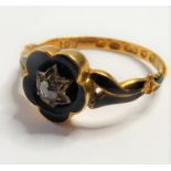 An early Victorian enamel, diamond-set and 18-carat yellow-gold mourning ring; the central black-