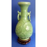 A Chinese celadon vase on hardwood stand (37cm without the stand)