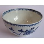 An 18th century Chinese porcelain tea bowl decorated to the exterior with flower heads and sprigs (