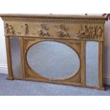 A 19th century Classical-style gilt frame over mantle mirror; the cornice with moulded leaves