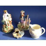 A mixed pottery group to include two mid-19th century Staffordshire figures, one with a shepherd