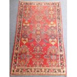 A north-west Persian Hamadan rug, predominately red ground (221cm x 136cm)