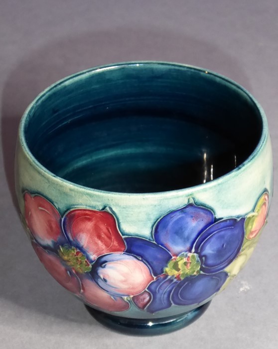 An early 20th century William Moorcroft Pottery pot of ovoid section; the outside body tube lined