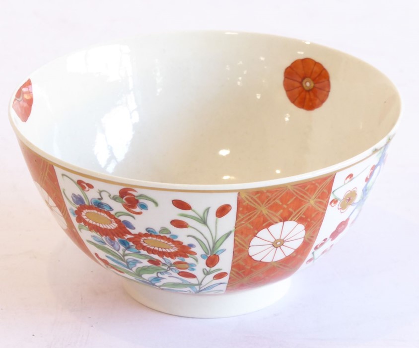 A late 19th century Japanese porcelain kutami-style bowl; the exterior painted with prunus blossom