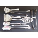 An interesting selection of ornate late 19th century silver-plated serving tongs, salad servers,