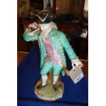 A 19th century Meissen figure model; in 18th century-style dress with a long green coat and