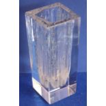 A heavy Brutalist style clear-glass vase; signed Daum, France to the bottom of one side (19.75cm