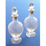 A good pair of ovoid-shaped glass decanters; each with a silver-mounted collar, maker's mark SG Ltd,