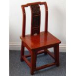 A rare 19th century Chinese red-lacquered hardwood miniature/child's chair; the angular yoke-