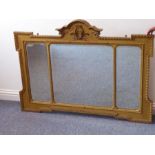 A 19th century gilt framed triple plate over mantle mirror; central shaped cornice with applied