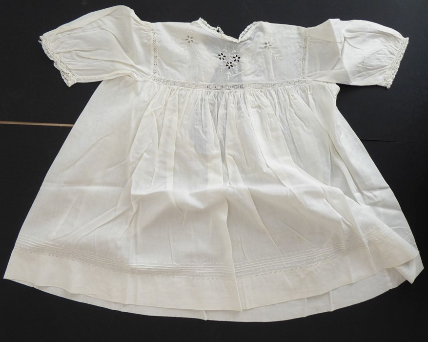 A circa 1930s child's dress; cotton lawn with white work detailing on yoke, C.B. opening