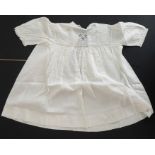 A circa 1930s child's dress; cotton lawn with white work detailing on yoke, C.B. opening