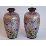 A pair of early 20th century Japanese cloisonné baluster-shaped vases; each decorated with flowers