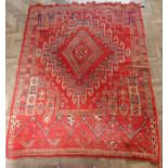 A good hand-knotted Berber tribal rug (High Atlas Mountains); the lozenges against a red ground