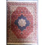 A thickly knotted Persian Senneh rug with central motif (104cm x 77cm)